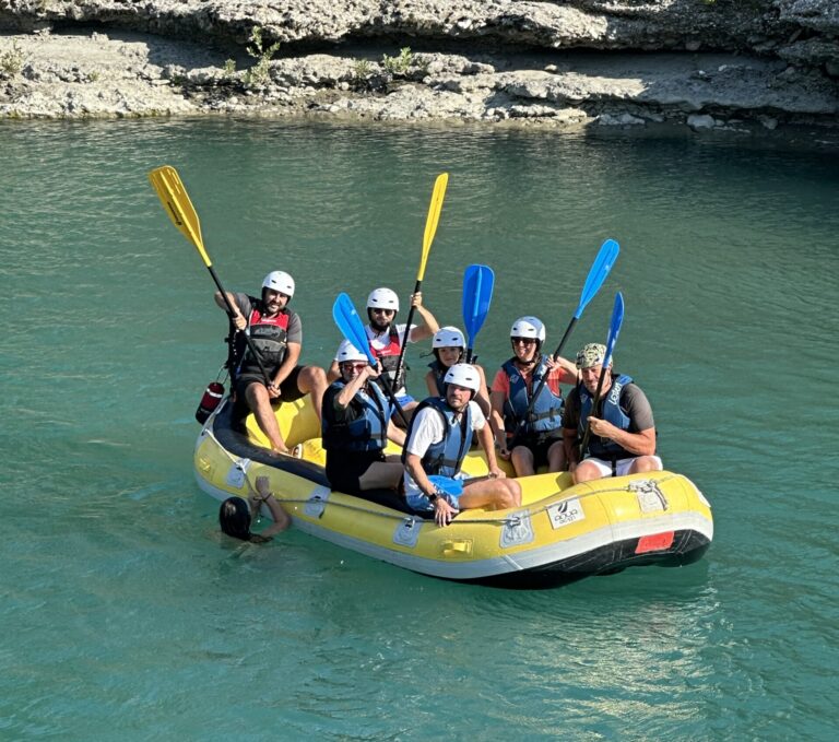 A group of friends enjoying rafting in Wild river of Vjosa