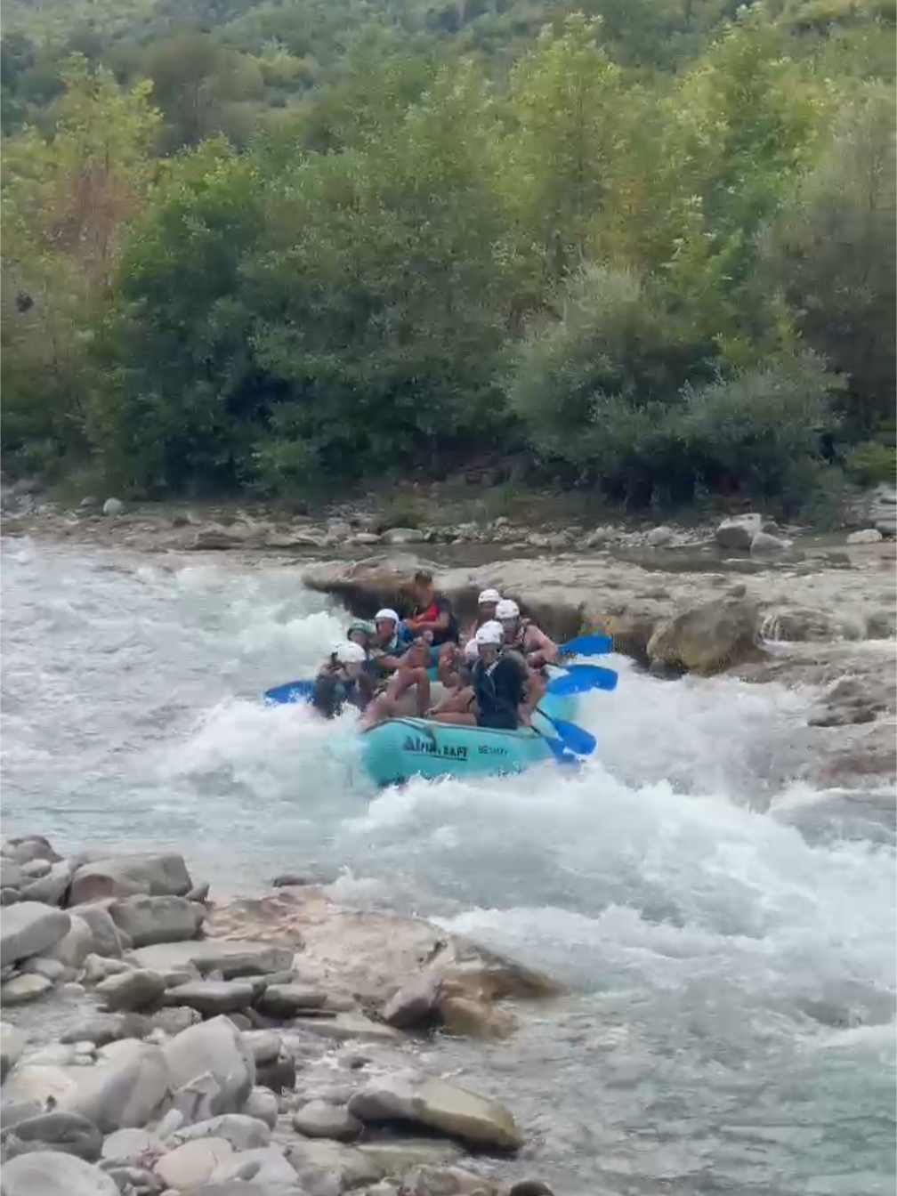 A group of people enjoying a thrilling rafting adventure on the Vjosa river.