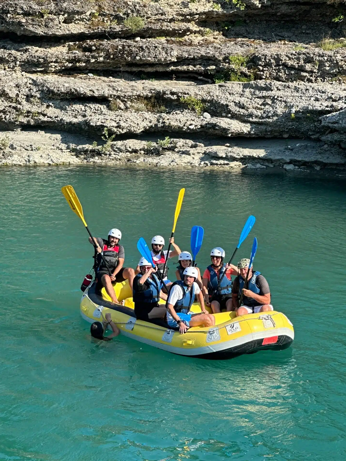 group of friends rafting in vjosa